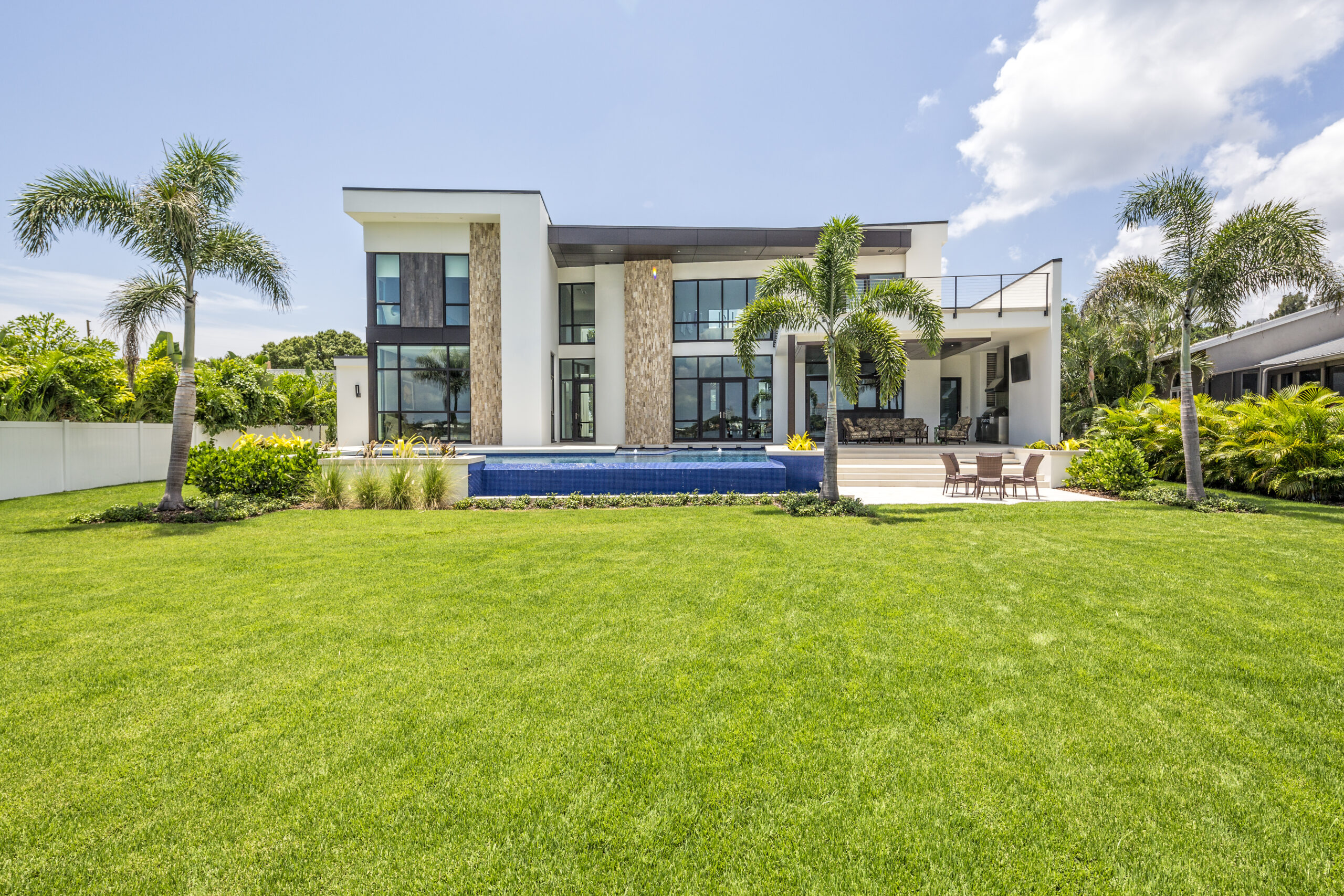 Lush South Florida landscape with manicured lawn and palms